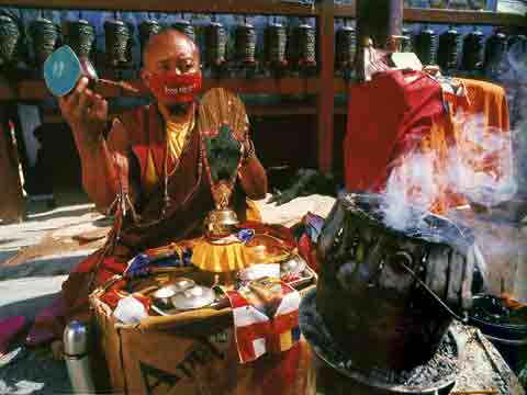 
Monk Reciting Mantras At Boudhanath Kathmandu Nepal - Buddhism: Eight Steps To Happiness by Dieter Glogowski book
